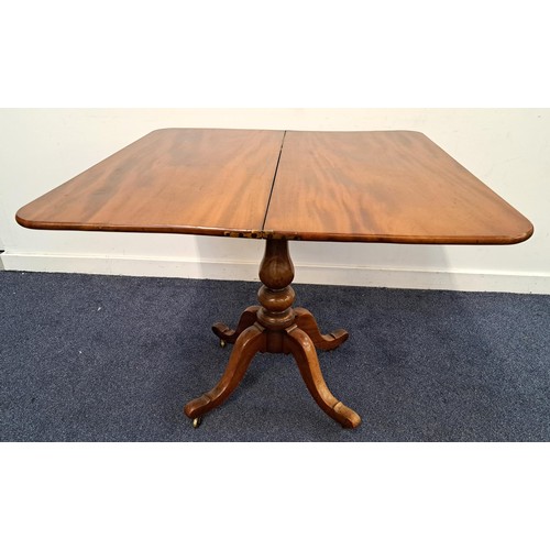 370 - 19th CENTURY MAHOGANY TEA TABLE
with a shaped fold over rotating top on a turned column with four ou... 