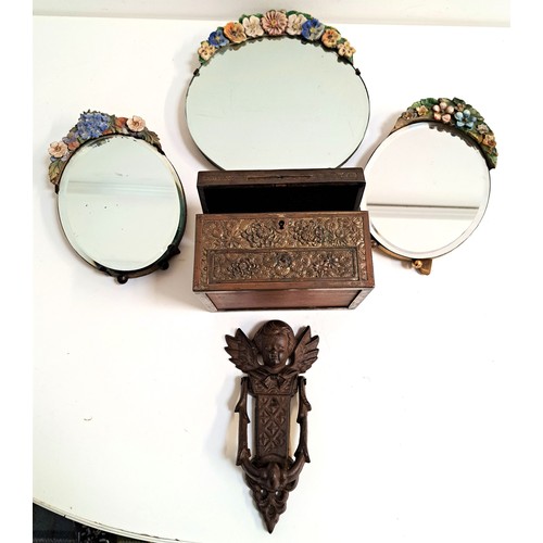 213 - THREE BARBOLA MIRRORS
a relief decorated metal jewellery box and a cast iron door knocker surmounted... 