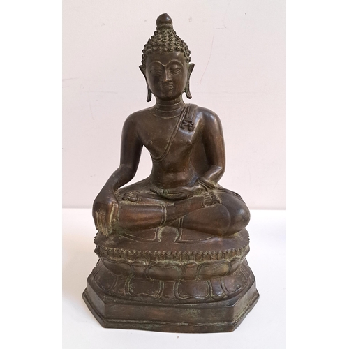 234 - 18th CENTURY BRONZE NEPALESE BUDDHA
seated on a lotus leaf base, 39.5cm high