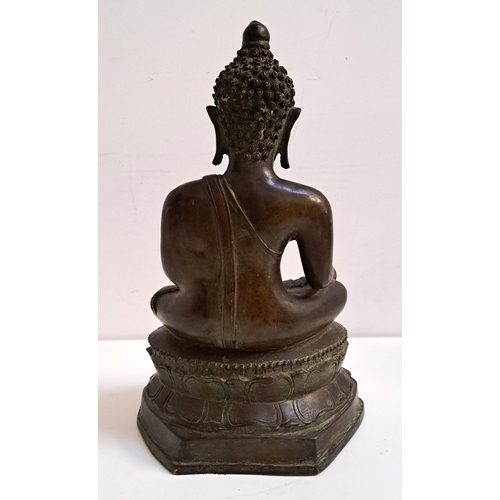 234 - 18th CENTURY BRONZE NEPALESE BUDDHA
seated on a lotus leaf base, 39.5cm high