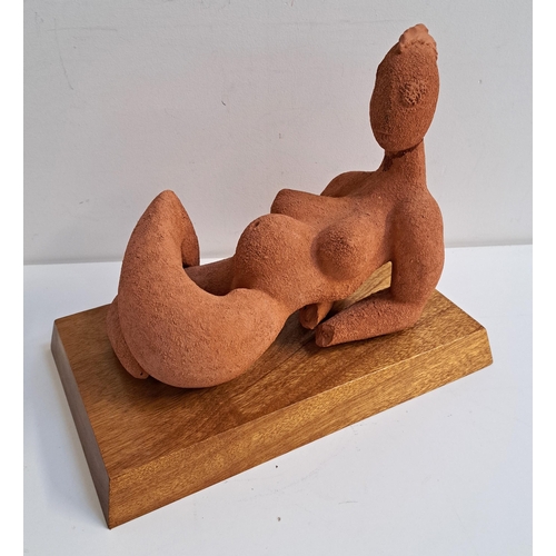 239 - CLIVE VINCENT JACHNIK
Reclining pregnant woman, terracotta study on a mahogany base, 31cm long