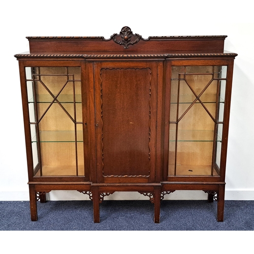 376 - MAHOGANY BREAKFRONT DISPLAY CABINET
with a carved and shaped raised mirror back above a central pane... 