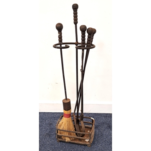 390 - EARLY 20th CENTURY FIRE IRON SET
comprising poker, tongs, shovel and brush in a shaped stand, all wi... 