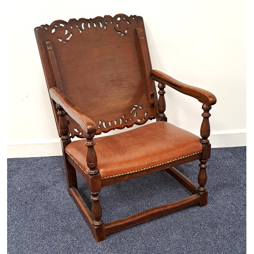 393 - OAK MONKS CHAIR
with a slide and fold-over carved and shaped back above shaped arms on turned column... 