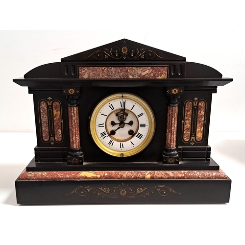 394 - VICTORIAN BLACK SLATE AND MARBLE MANTEL CLOCK
of architectural outline with a circular brass and ena... 