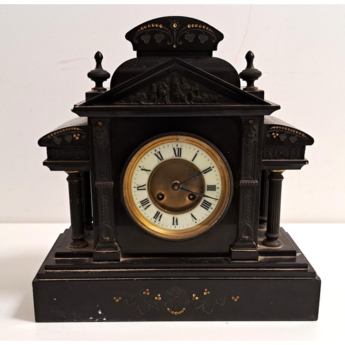 395 - VICTORIAN BLACK SLATE MANTLE CLOCK
of architectural outline with a circular brass and enamel dial wi... 