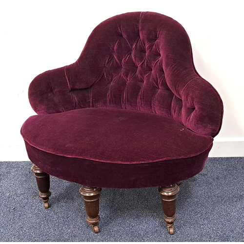 403 - EDWARDIAN PARLOUR ARMCHAIR
with a shaped button back above a stuffover seat, covered in a purple vel... 