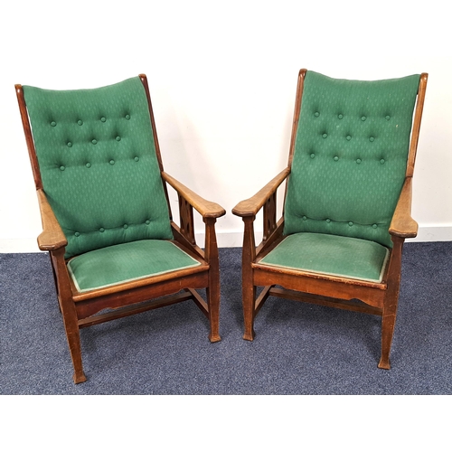 404 - PAIR OF ARTS AND CRAFTS WALNUT ARMCHAIRS
with button backs, padded seats, shaped arms and pierced si... 