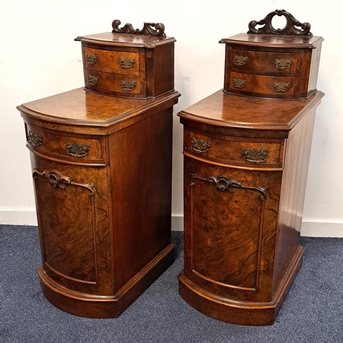 412 - PAIR OF WALNUT BOW FRONT PEDESTALS
with carved raised backs above two short drawers, the bases with ... 