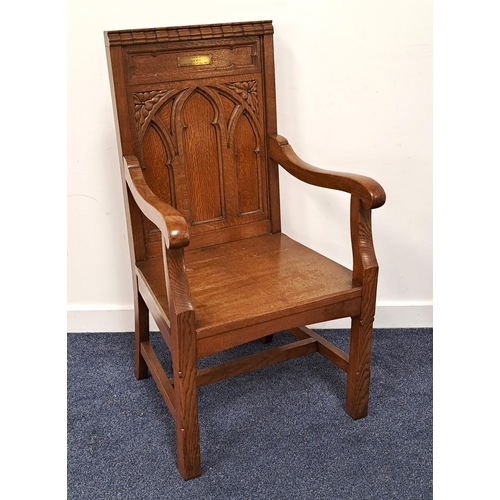 430 - OAK GOTHIC CHAPEL ARMCHAIR
the carved panel back with a brass memorial plaque and shaped arms above ... 