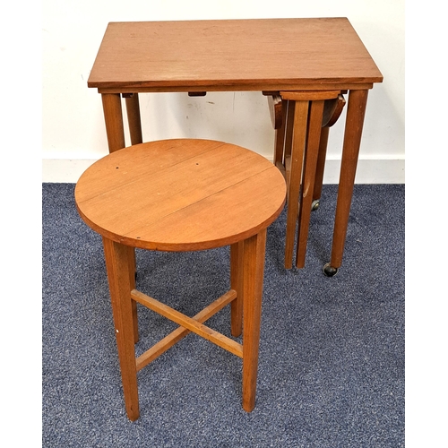 439 - TEAK OCCASIONAL TABLE
with a rectangular top standing on shaped supports with casters, having two sl... 