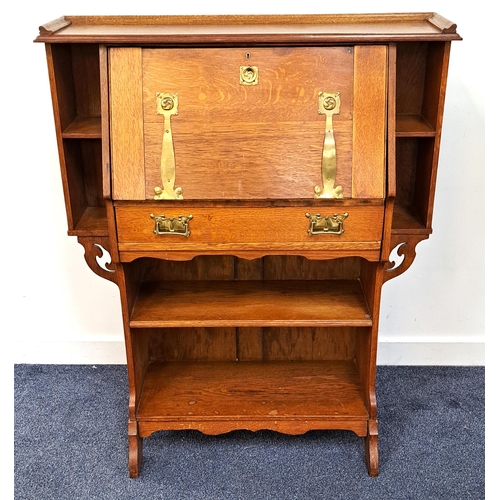 441 - ARTS AND CRAFTS OAK BUREAU
with a galleried top above a fall flap with ornate brass hinges and handl... 