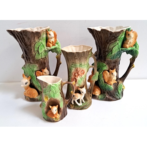 165 - FOUR PIECES OF HORNSEA POTTERY
all of tree trunk form with applied deer and squirrels, comprising fo... 