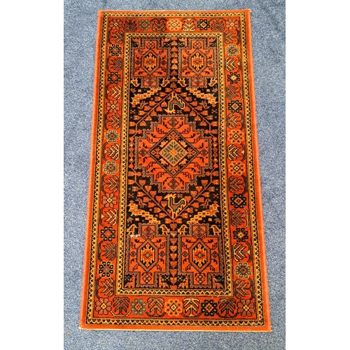 444 - HAMADAN RUG
with a red ground and a central diamond motif, 136cm x 68cm