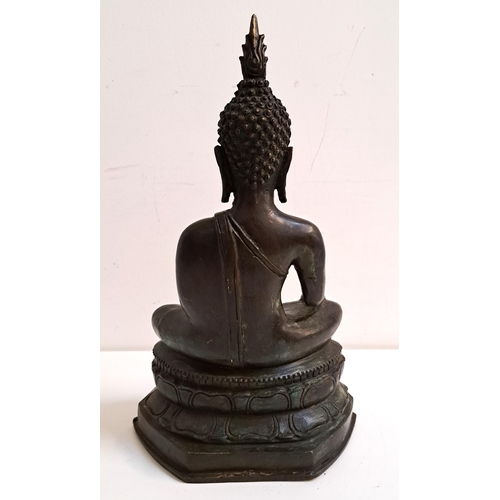 235 - 18th CENTURY BRONZE THAI BUDDHA
seated on a lotus leaf base, 42cm high