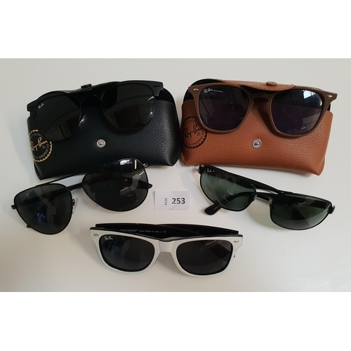 253 - FIVE PAIRS OF DESIGNER SUNGLASSES
comprising four pairs of Ray-Ban and one pair of Prada (5)