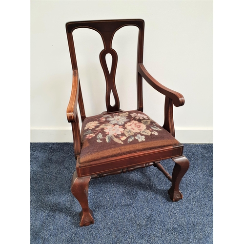 320 - APPRENTICE CHILD'S MAHOGANY ARMCHAIR
with a central pierced splat and shaped arms above a floral dec... 