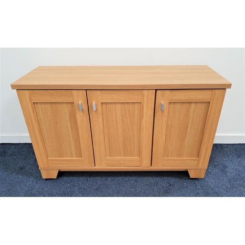 333 - WOODBERRY BROTHERS LIGHT OAK SIDE CABINET
with a rectangular top above three panelled doors, standin... 