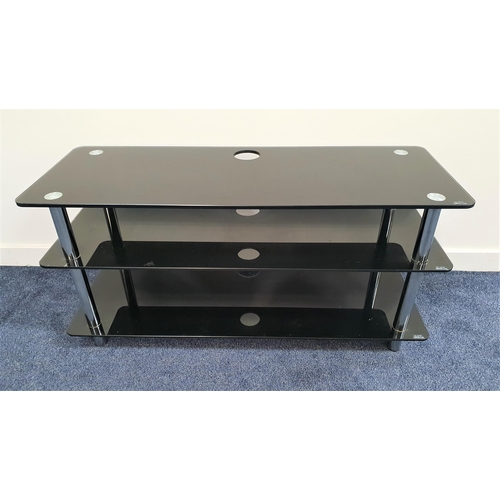 335 - TELEVISION STAND
with three black glass shelves with tubular steel supports, 53cm x 110cm