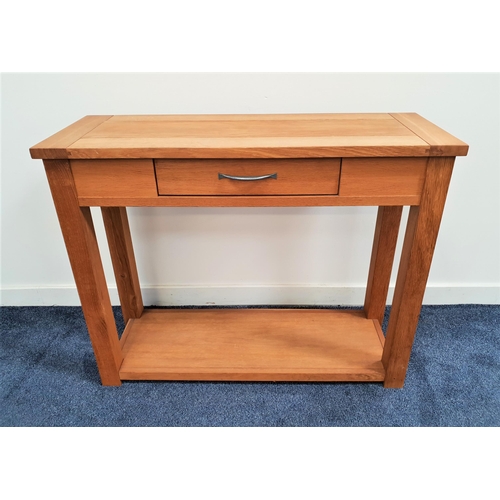 352 - NEXT OAK HALL TABLE
the rectangular top above a central frieze drawer with a shelf below, standing o... 