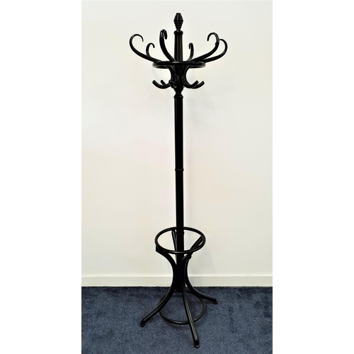 371 - EBONISED HAT AND COAT STAND
the central turned column with six shaped hat and coat hooks above four ... 