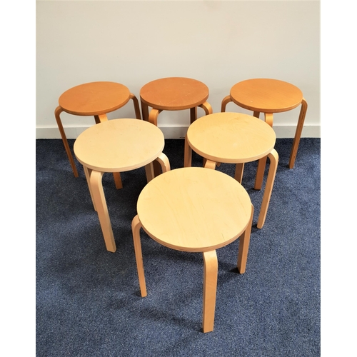 375 - SIX BIRCH STOOLS
of laminated construction with circular seats on four shaped supports, 45.5cm high ... 