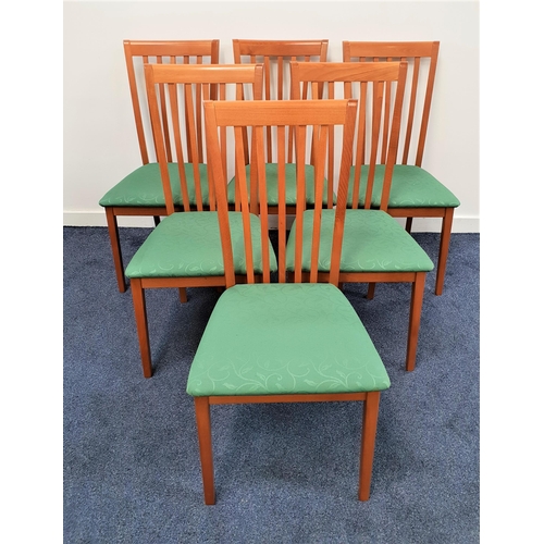 346 - SET OF SIX MORRIS COMPANY TEAK DINING CHAIRS
with slatted backs above stuffover seats, standing on p... 