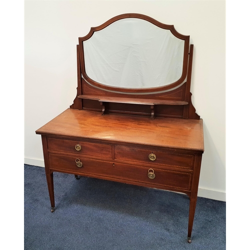 394 - EDWARDIAN MAHOGANY AND INLAID DRESSING CHEST
the shaped bevelled mirror back above a shaped shelf, t... 