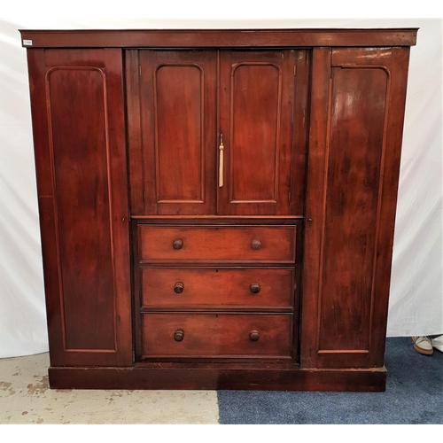 396 - VICTORIAN MAHOGANY WARDROBE
with a pair of short central panelled cupboard doors above three cockbea... 