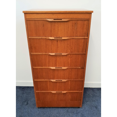 399 - STONEHILL TEAK CHEST OF DRAWERS
of narrow proportions with six drawers having pierced roll over hand... 