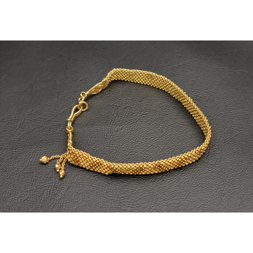 1 - TWENTY-TWO CARAT GOLD BEADED MESH BRACELET
the small beads on a mesh brand with alternating lines of... 