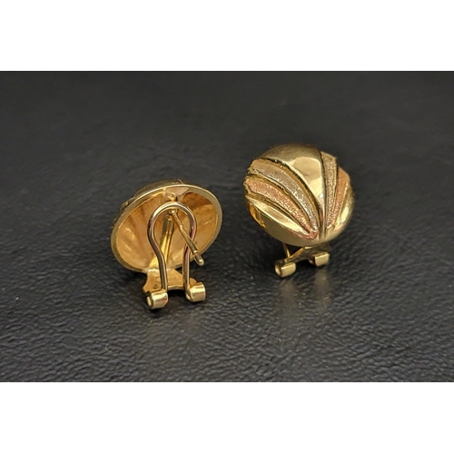 13 - PAIR OF EIGHTEEN CARAT GOLD EARRINGS
the round shell motif earrings with white and rose colour accen... 