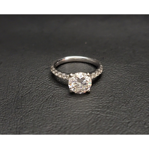 43 - DIAMOND SOLITAIRE RING 
the central round brilliant cut diamond approximately 1.7cts, flanked by six... 