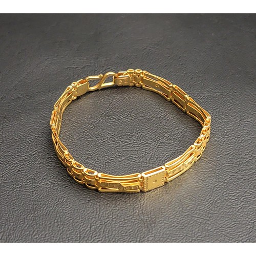 4 - TWENTY-TWO CARAT GOLD BRACELET
the decorative square and rectangular link bracelet of brushed and po... 