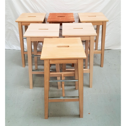 353 - SET OF SIX OAK KITCHEN STOOLS
with rectangular tops with a hand hole, on tapering supports united by... 