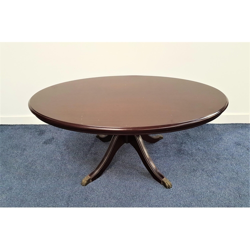 358 - MAHOGANY OCCASIONAL TABLE
with an oval top on a central column with four outswept supports with bras... 