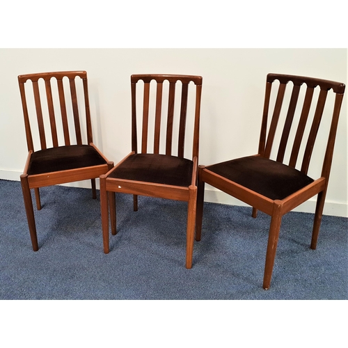 362 - THREE MEREDEW TEAK DINING CHAIRS
with slatted backs above drop in seats, standing on turned supports... 