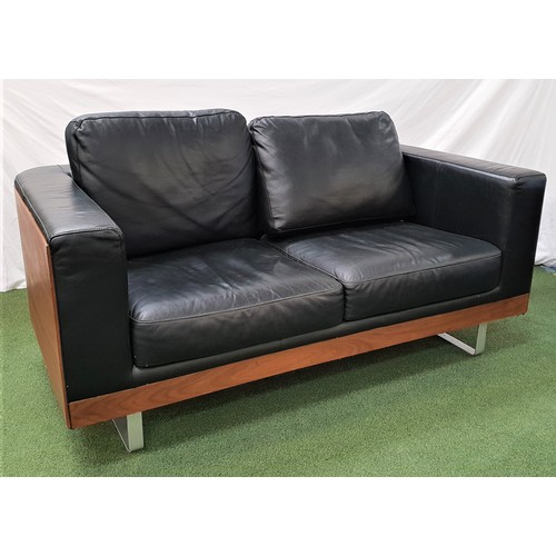 388 - DWELL WALNUT AND LEATHER SOFA
with a shaped frame and on shaped steel supports, 161cm wide