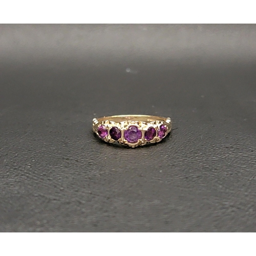 63 - PRETTY AMETHYST FIVE STONE RING
the graduated round cut amethysts ranging from approximately 0.25cts... 