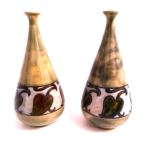 169 - PAIR OF ROYAL DOULTON STONEWARE SPILL VASES
of conical form and decorated with a mottled green groun... 