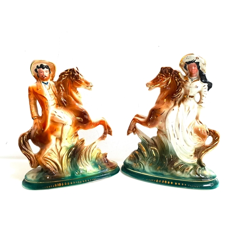 172 - PAIR OF EARLY 20th CENTURY BONESS POTTERY FIGURES
depicting Buffalo Bill and Annie Oakley, both on r... 