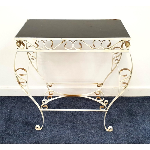 437 - WROUGHT IRON HALL TABLE
with a smoked glass inset top on an ornate frame with shaped supports, 76cm ... 