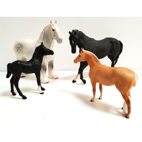 175 - FOUR BESWICK HORSES
including a black stallion, 18cm high; black foal, 15cm high; grey Shire, 21cm h... 