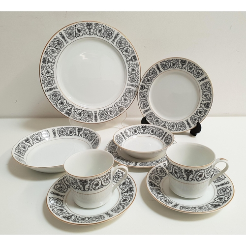 195 - COVENTRY FINE CHINA DINNER/TEA SET
in the Laurent pattern (number 653), all with black scroll border... 