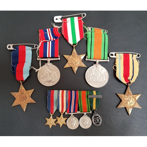 297 - WORLD WAR II MADALS
comprising The British War Medal 1939-1945, The Defence Medal 1939-1945, The Afr... 