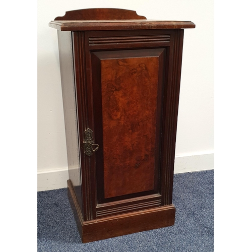 428 - EDWARDIAN WALNUT POT CUPBOARD
with a shaped raised back above a moulded top with a panelled cupboard... 