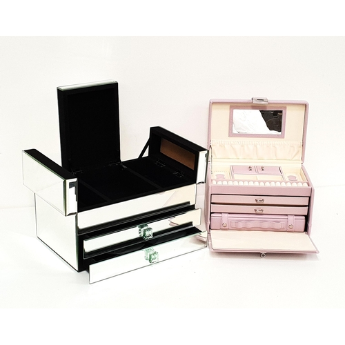 253 - TWO JEWELLERY CASES
one in lilac leather effect with fitted and mirrored interior; the other mirrore... 