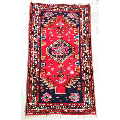 449 - PERSIAN SHIRAZ RUG
with a red ground, central diamond motif and stylised border, fringed, 172cm x 10... 