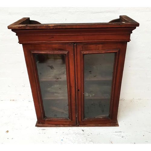 451 - EARLY 20th CENTURY MAHOGANY CUPBOARD
with a pair of glass panelled doors opening to reveal a shelved... 