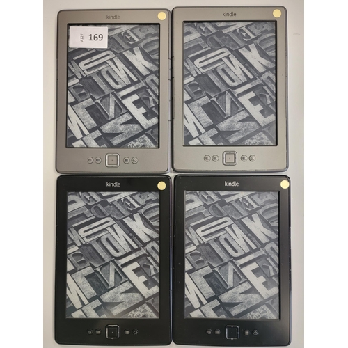 169 - FOUR AMAZON KINDLE E-READERS
comprising two No Touch silver, serial numbers B00E 1501 1446 1WE6, B00... 